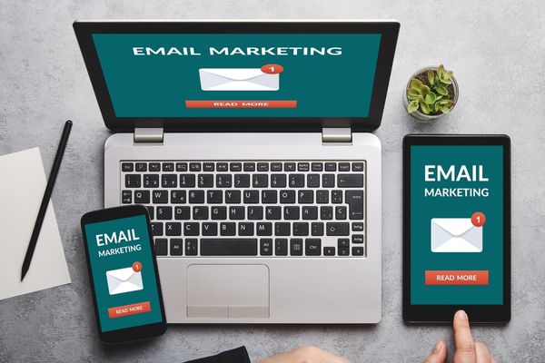 Email Marketing Strategy on a Laptop, Cell Phone, and Tablet